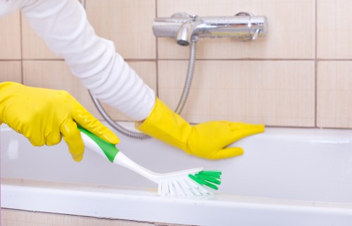 Upholstery cleaning equipment beside a fabric sofa in Clapham