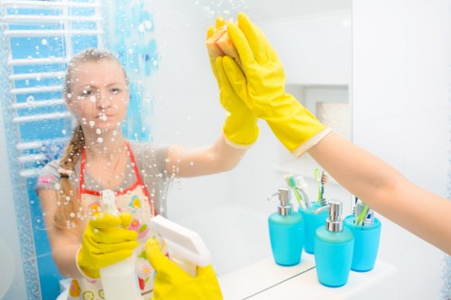 Local cleaners working in a Clapham flat with careful attention to detail